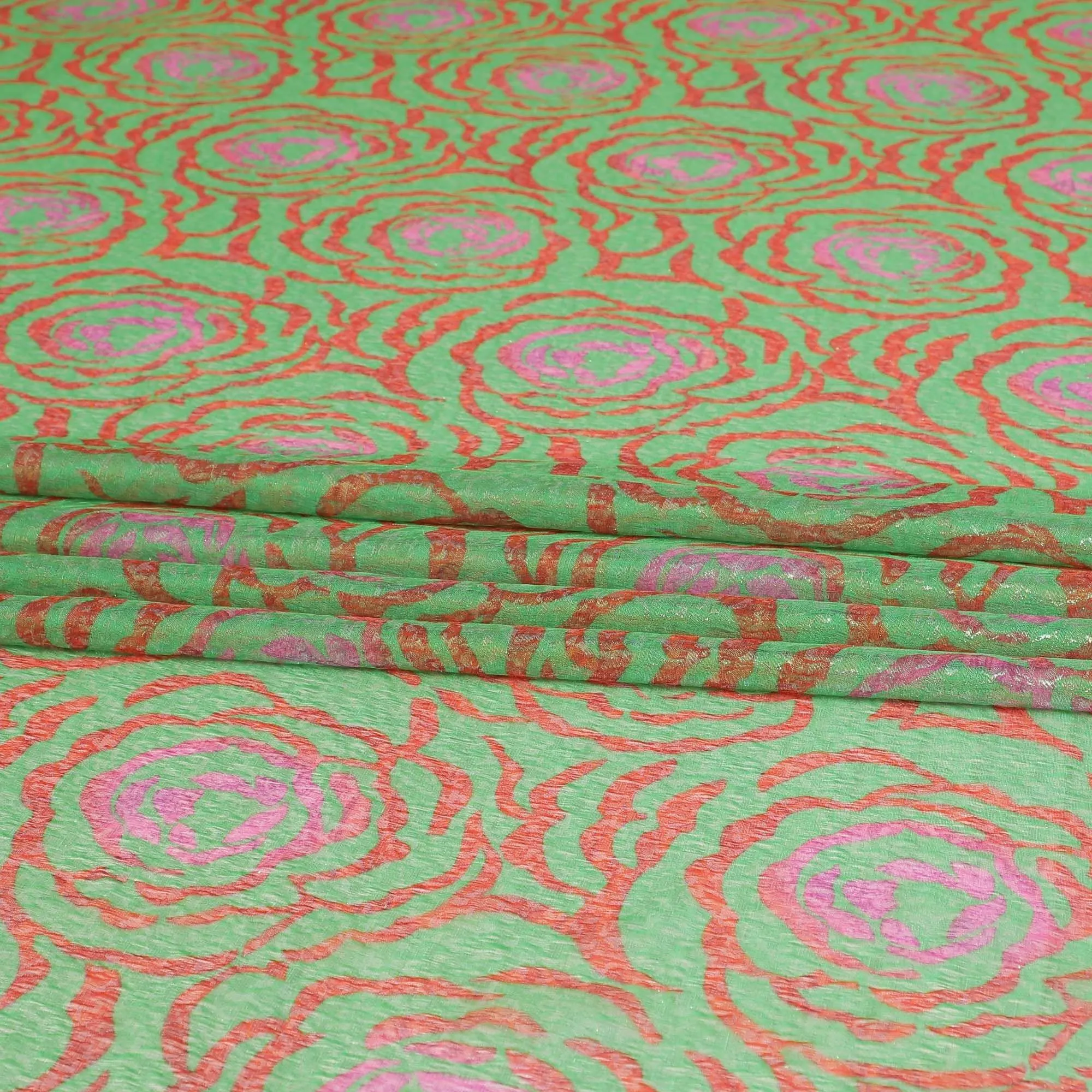 Pastel green pure silk chiffon fabric with brick red and hot pink print having gold metallic lurex in fancy design-D8983